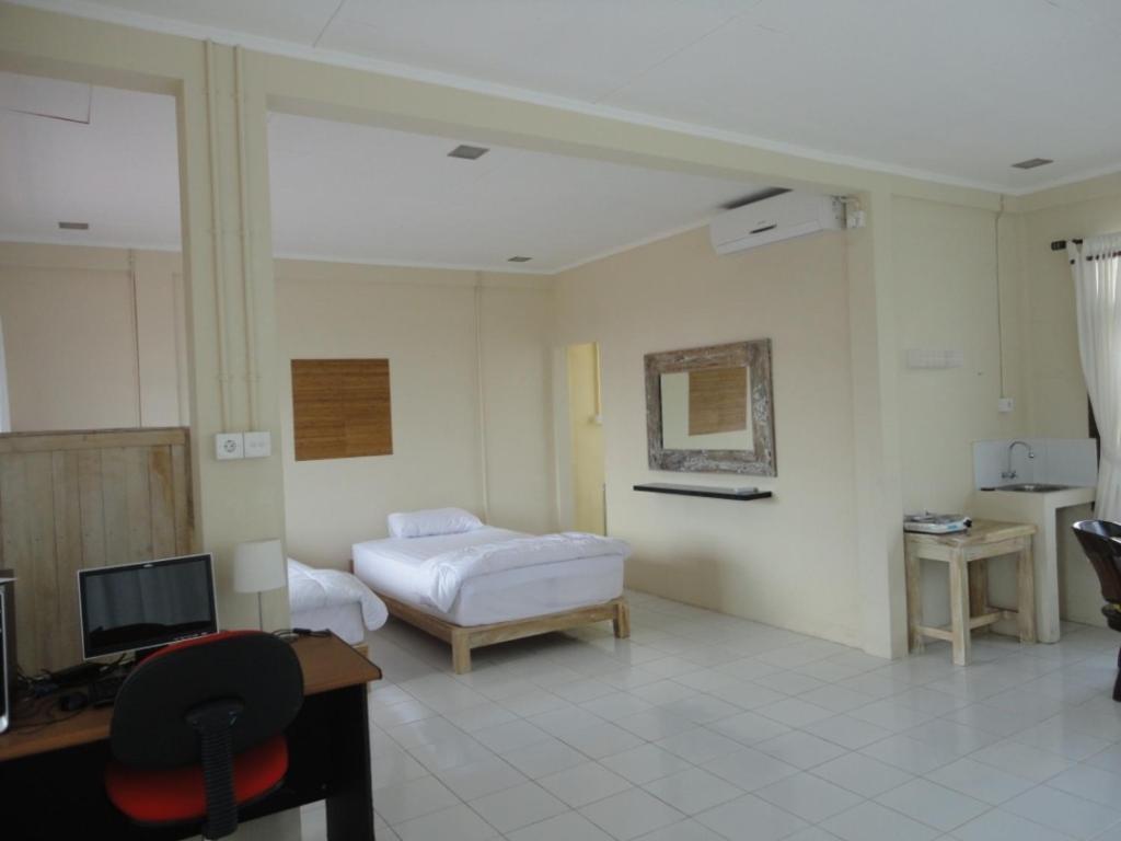 Urbanview Hotel Wayan Mansion Denpasar Habitación foto